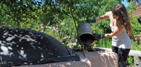 A woman washing her car