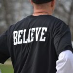 A man wearing mark tshirt