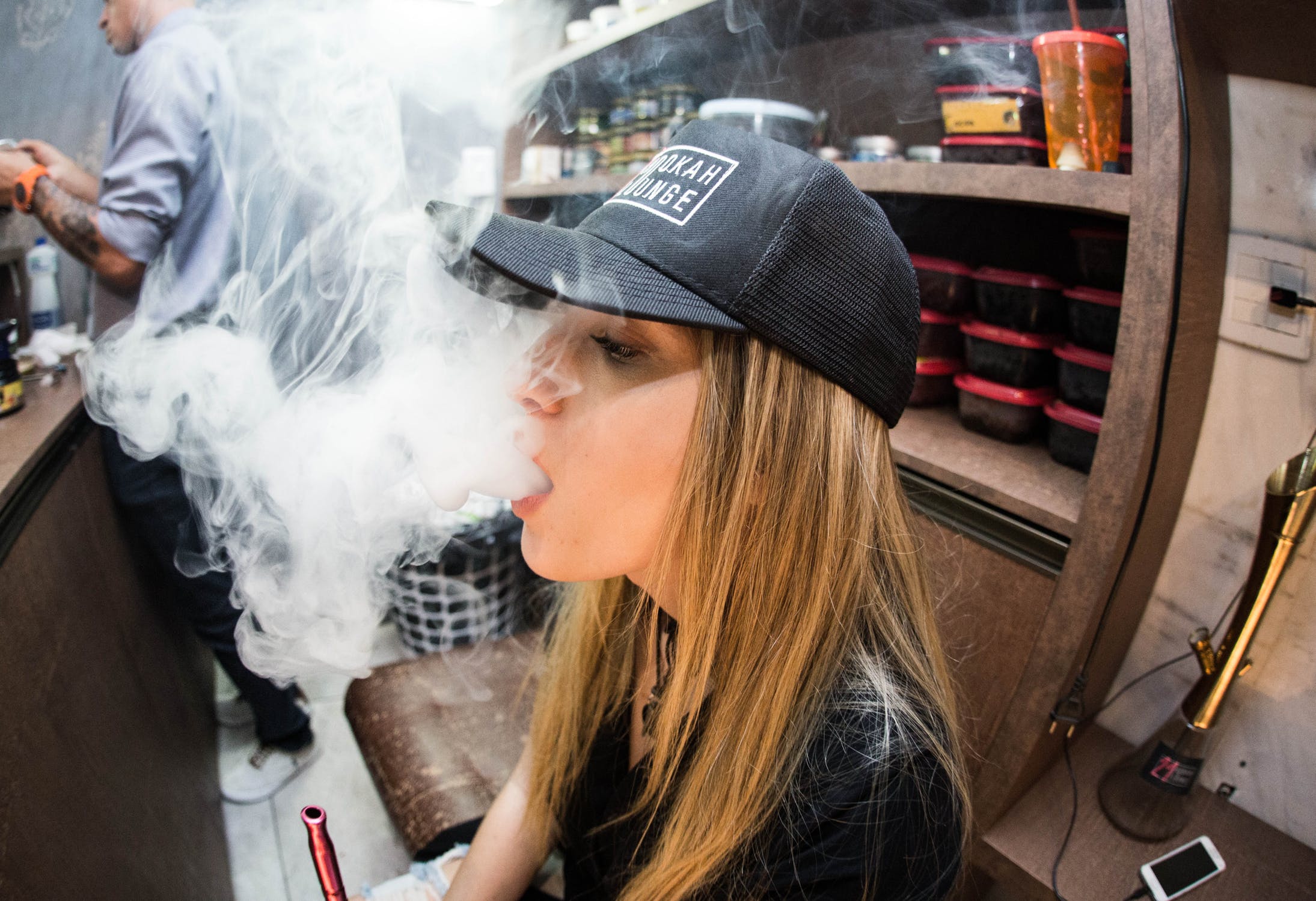 Beautiful woman using vape